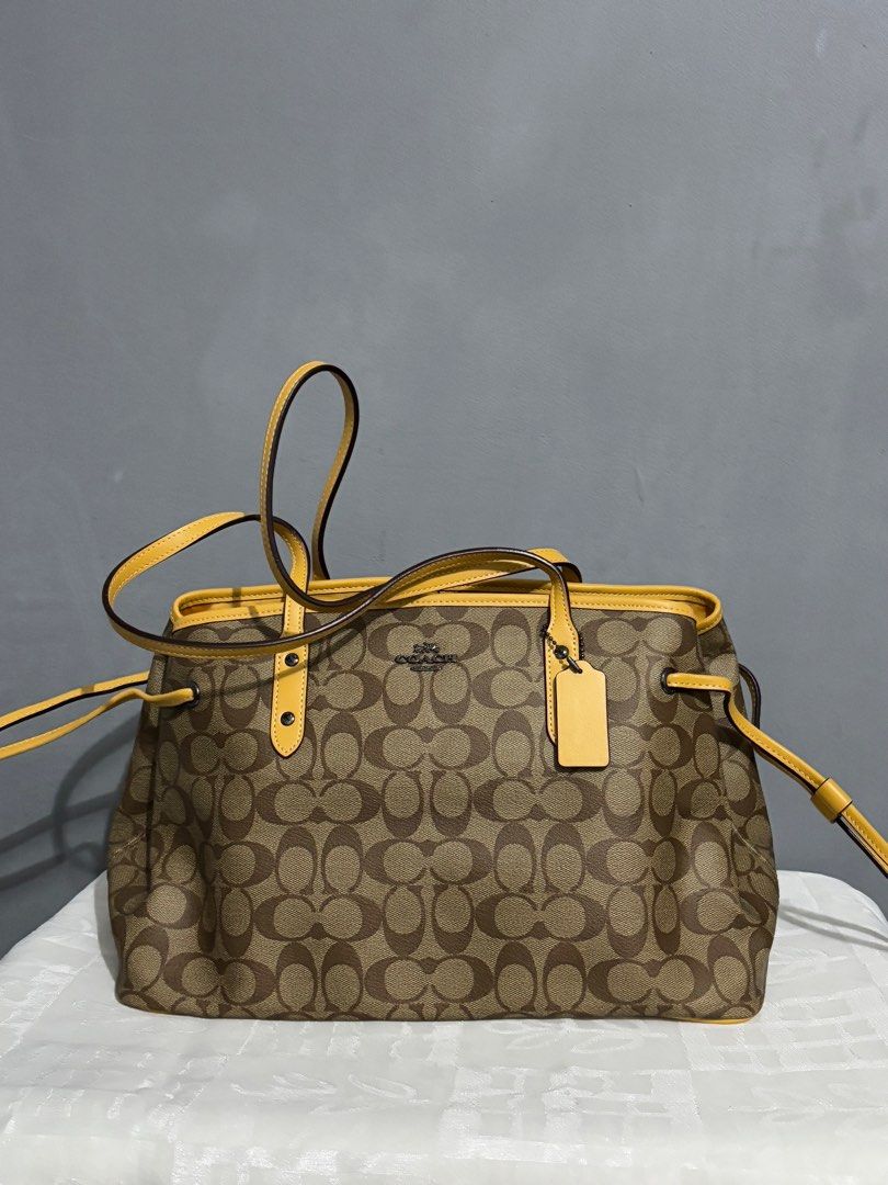 Coach Drawstring Carryall in Signature Canvas (Category: Luxury Bags & Wallets) located in Manila. Submitted by mitochondriaa (Listing ID 1358305827, Image 1). Description: Rfs: Need funds for hospital bills.