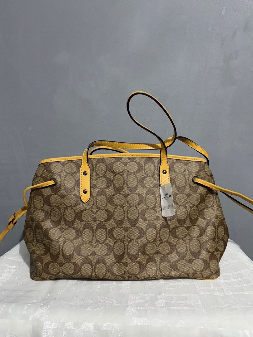 Coach Drawstring Carryall in Signature Canvas (Category: Luxury Bags & Wallets) located in Manila. Submitted by mitochondriaa (Listing ID 1358305827, Image 2). Description: Rfs: Need funds for hospital bills.