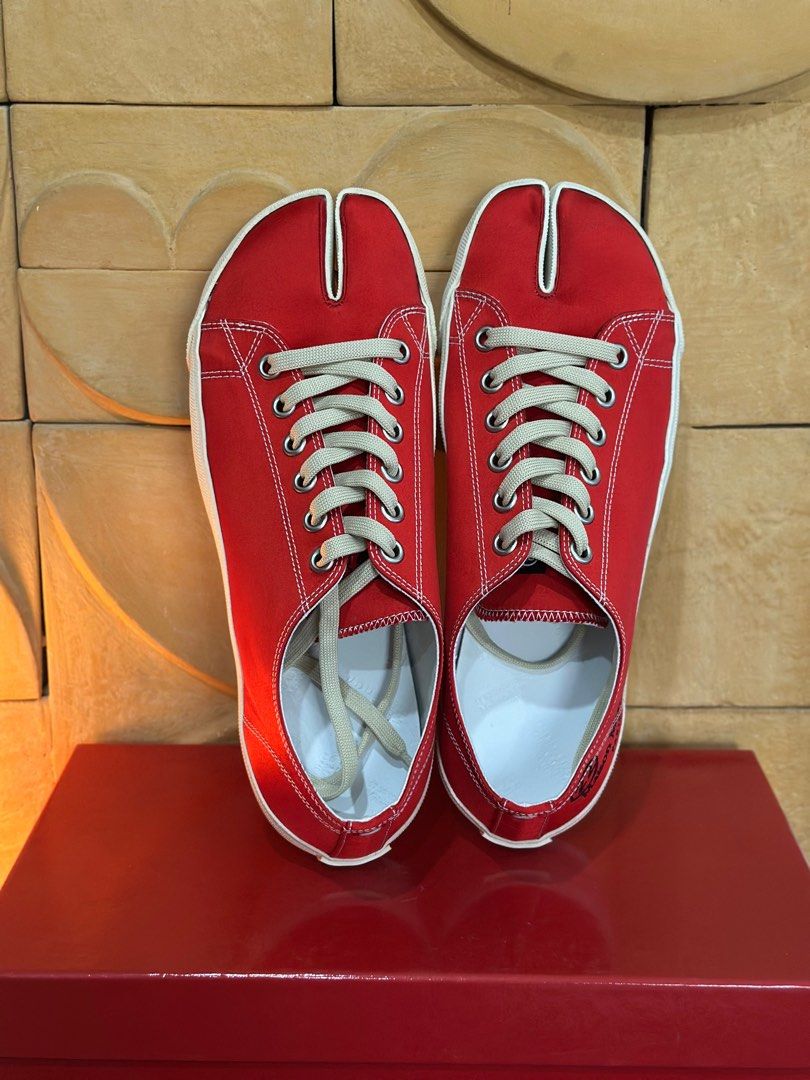 Maison Margiela Tabi Sneakers 43 (Category: Sneakers) located in San Fernando. Submitted by dopeeywobeey (Listing ID 1358193970, Image 2). Description: Maison Margiela Tabi Sneakers in Red Satin Limited Edition Tabi Sneakers Comes with Box, Dustbags and Tags Guaranteed Authentic Selling below retail Never Used Size 43 Fits 42-43.