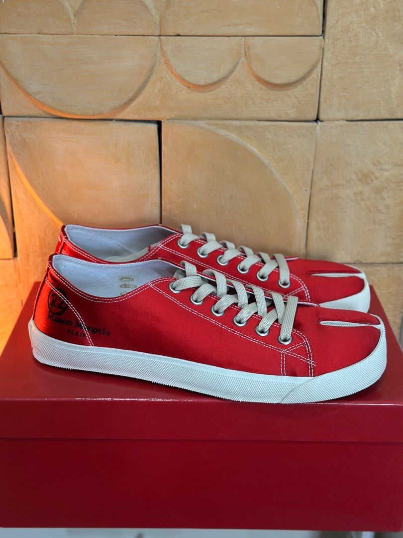 Maison Margiela Tabi Sneakers 43 (Category: Sneakers) located in San Fernando. Submitted by dopeeywobeey (Listing ID 1358193970, Image 1). Description: Maison Margiela Tabi Sneakers in Red Satin Limited Edition Tabi Sneakers Comes with Box, Dustbags and Tags Guaranteed Authentic Selling below retail Never Used Size 43 Fits 42-43.