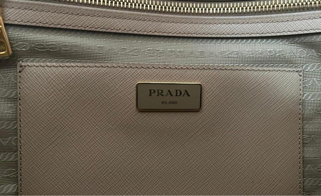 Prada Saffiano Lux Double Zip (Large) (Category: Luxury Bags & Wallets) located in Pasig City. Submitted by fl4ck0m7g_ (Listing ID 1358221177, Image 3). Description: Prado Saffiano Lux Double Zip Large Color: Sabbia Almost new pristine condition with free filler and handle wrap (c/o lovemybag.ph) with Authenticity card 50,000 only still negotiable.
