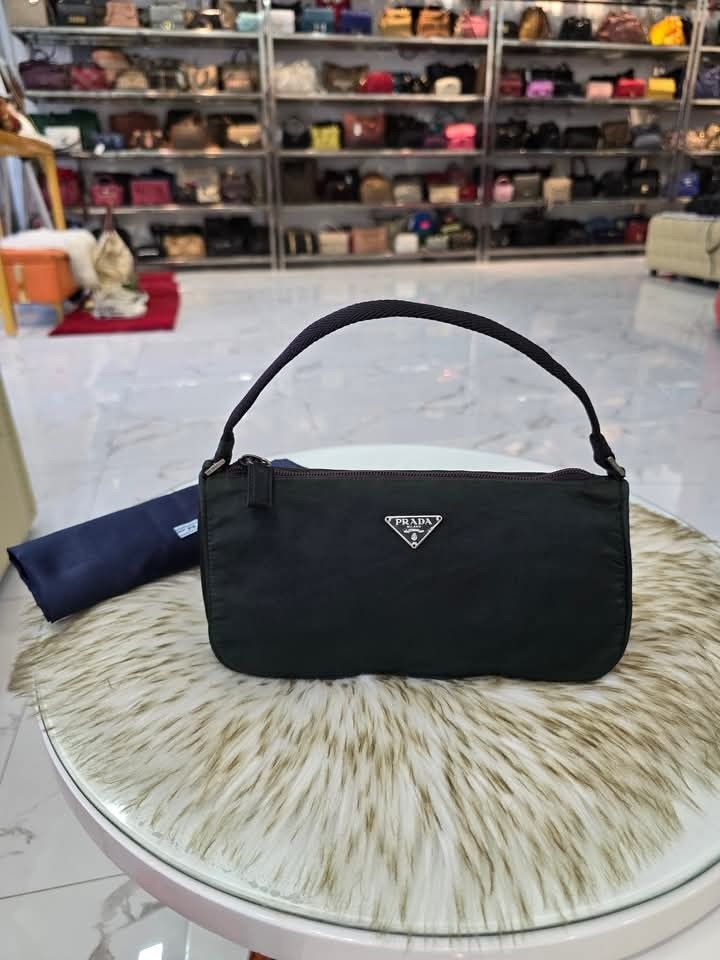 💋 Prada Vela Nylon Small Baguette Bag (Category: Luxury Bags & Wallets) located in Clarin. Submitted by myclosetph143 (Listing ID 1358497432, Image 3). Description: Prada Vela Nylon Small Baguette Bag P15,980+sf Small size Guaranteed Authentic 💯 In very good condition 📍Not affiliated or associated with any brand posted. All brands, product names and logos are the property of their respective original brand.