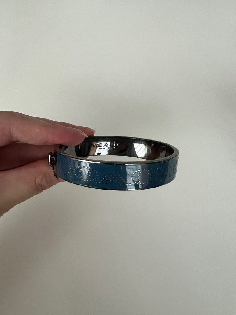Coach Bangle in Blue and Silver (Category: Bracelets) located in Makati City. Submitted by macypants (Listing ID 1358369285, Image 2). Description: Authentic Coach Bangle Blue and silver No major flaws Excellent condition No inclusions.