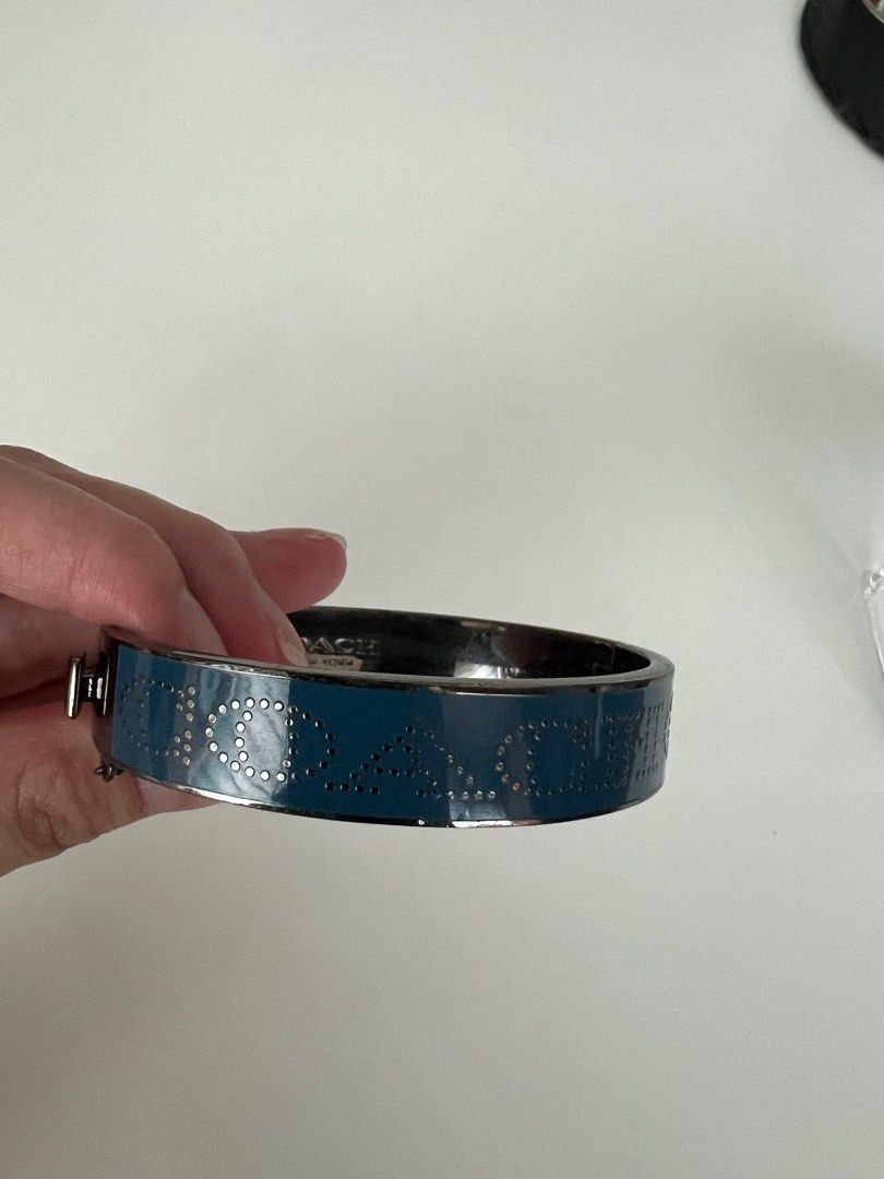 Coach Bangle in Blue and Silver (Category: Bracelets) located in Makati City. Submitted by macypants (Listing ID 1358369285, Image 3). Description: Authentic Coach Bangle Blue and silver No major flaws Excellent condition No inclusions.