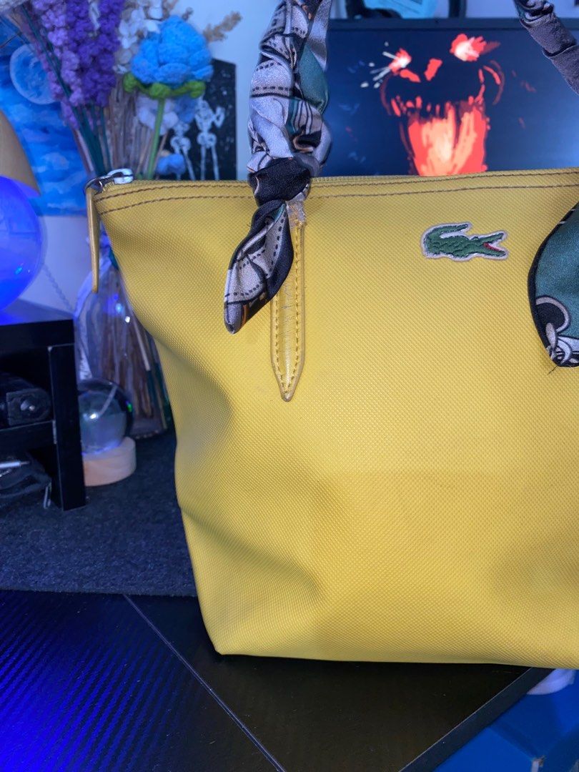 Lacoste Yellow Shoulder Bag (Category: Luxury Bags & Wallets) located in Quezon City. Submitted by 9abriel (Listing ID 1358388393, Image 3). Description: Selling my mom’s preloved Shoulder Bag for ₱1,500 Negotiable, HUGE PASS SA LOWBALL Small Size Width: 12 inches Length: 9 inches Issue is the hawakan (strap) ahe covered it with a cloth nalang , but overall the item is like new! No scratches or holes sa mismong bag. Authentic Bag with tags also. 