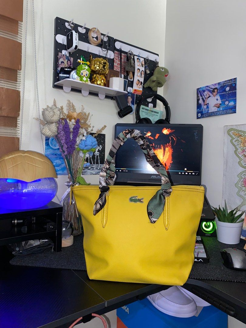 Lacoste Yellow Shoulder Bag (Category: Luxury Bags & Wallets) located in Quezon City. Submitted by 9abriel (Listing ID 1358388393, Image 1). Description: Selling my mom’s preloved Shoulder Bag for ₱1,500 Negotiable, HUGE PASS SA LOWBALL Small Size Width: 12 inches Length: 9 inches Issue is the hawakan (strap) ahe covered it with a cloth nalang , but overall the item is like new! No scratches or holes sa mismong bag. Authentic Bag with tags also. 