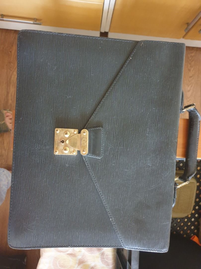 Louis Vuitton LV Authentic Briefcase bag, vintage (Category: Luxury Bags & Wallets) located in Taguig. Submitted by maiovermatter (Listing ID 1358437459, Image 2). Description: Louis Vuitton LV Briefcase Bag Guaranteed Authentic, Designer Luxury Bag black and gold Perfect for the office No flaws, just signs of use great vintage condition medium sized Selling for 18K, being sold in Carousell for 20K above, Being sold abroad for 30K+ Super great de