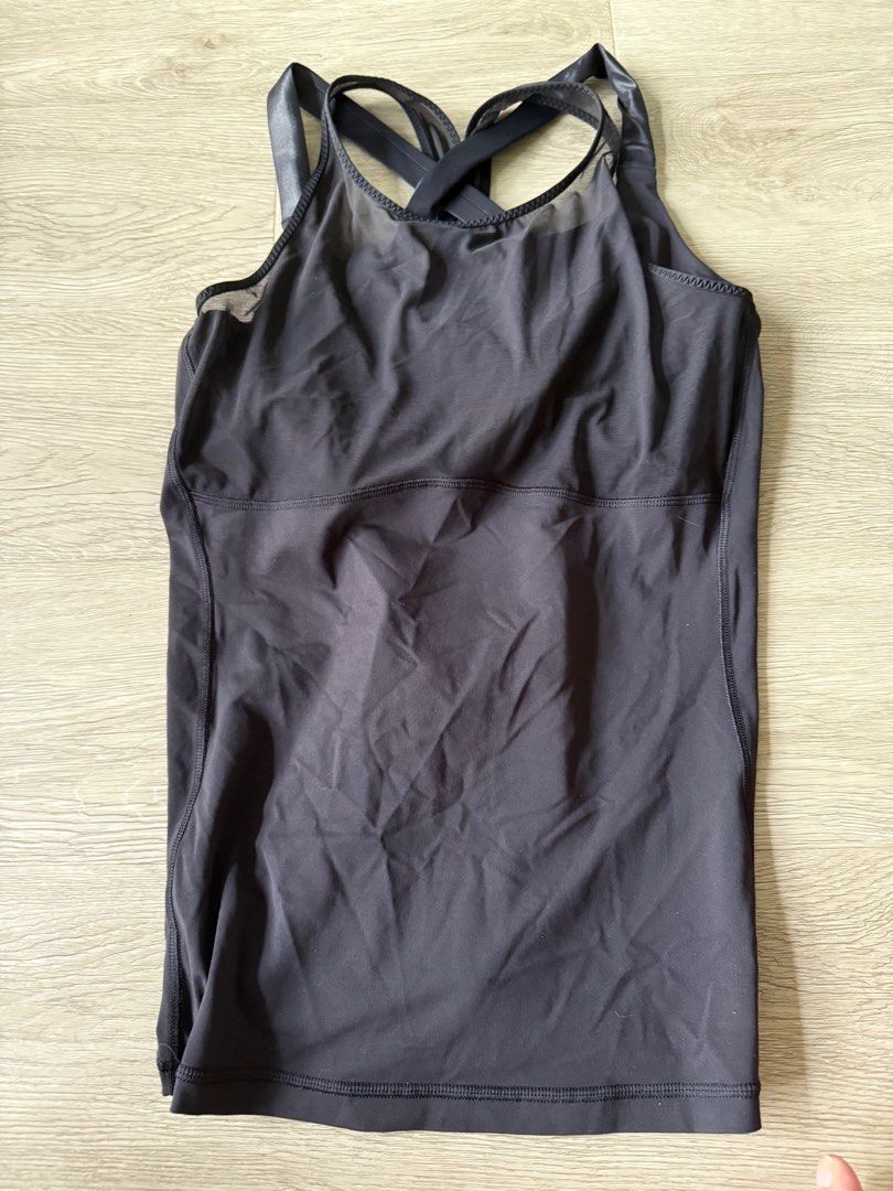 Lululemon Yoga Black Top with built in bra US Size 10 (Category: Activewear) located in Singapore. Submitted by rayray151515 (Listing ID 1358354160, Image 1). Description: Black yoga top with built in bra. No padding US Size 10.