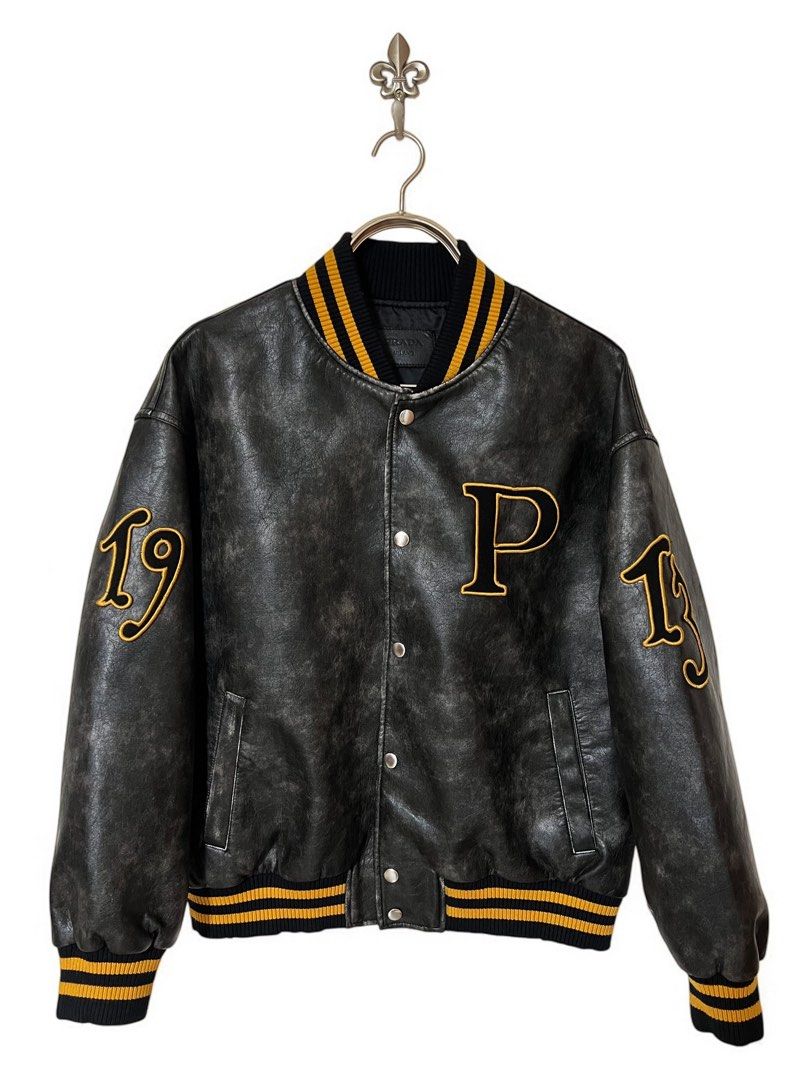 ⚜️Prada leather Varsity Jacket (Category: Luxury Apparel) located in Makati City. Submitted by 90sangel (Listing ID 1358479307, Image 1). Description: •Item: Prada varsity leather - from look #88 / 154 prada runway ⚜️ •Size: M 23" x 26" •Condition: Excellent! no hidden issues *This includes original paperbag ~ as seen on Blackpink Jennie 🖤🩷 & woo seok.
