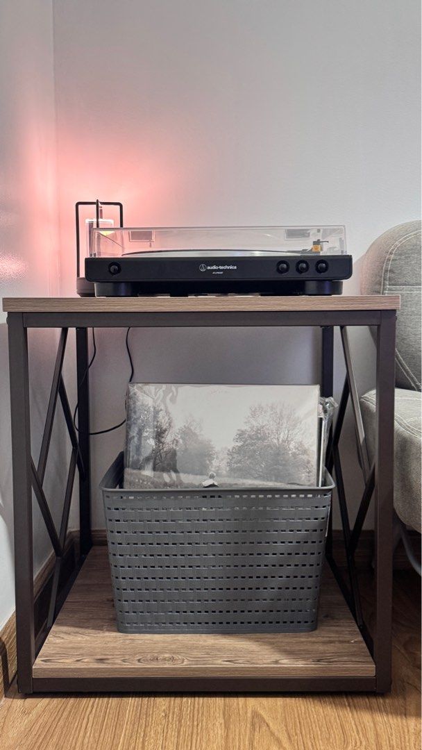 San-Yang Side Table (Category: Tables & Sets) located in Quezon City. Submitted by 93191208x (Listing ID 1358435491, Image 2). Description: RFS: Extra item. Hindi na kasya sa sala ko. 🥹 Yung isa ginagamit ko as table for my turntable player. ❗️Turntable player, vinyl record, table lamp not for sale. Details (from orange app): San-Yang Side Table 201608 Made from Particle Board, Metal Frame, and PVC Color: Oak Size: 51 x 51 x 54.5 cm (LWH) Easy t