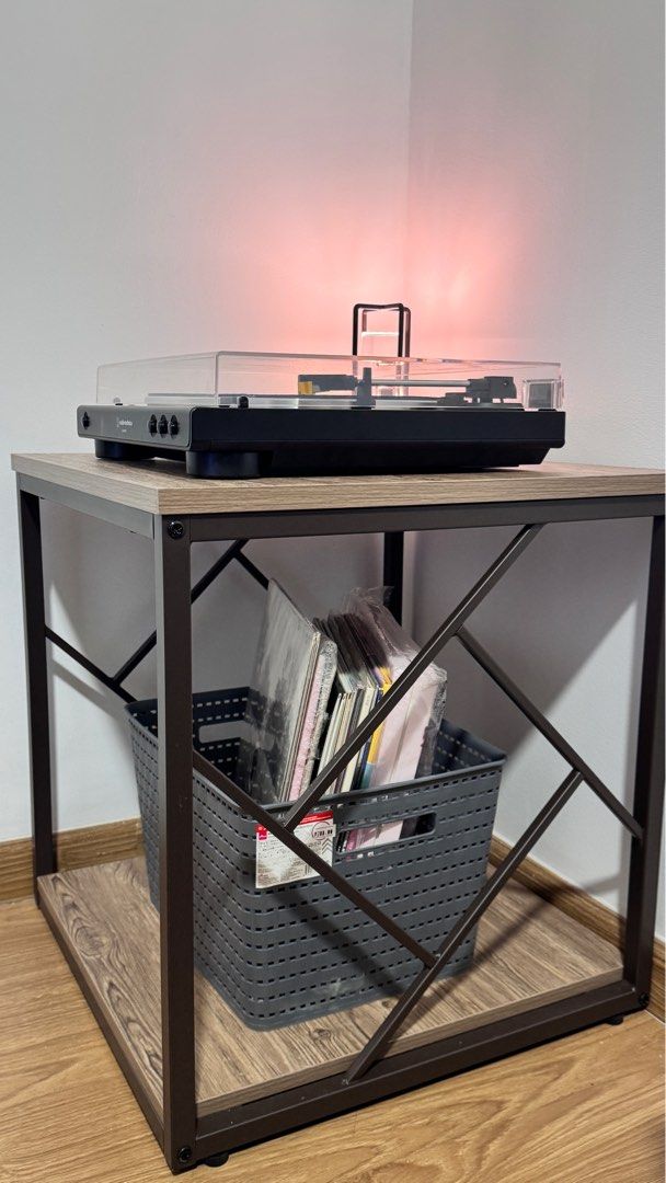 San-Yang Side Table (Category: Tables & Sets) located in Quezon City. Submitted by 93191208x (Listing ID 1358435491, Image 1). Description: RFS: Extra item. Hindi na kasya sa sala ko. 🥹 Yung isa ginagamit ko as table for my turntable player. ❗️Turntable player, vinyl record, table lamp not for sale. Details (from orange app): San-Yang Side Table 201608 Made from Particle Board, Metal Frame, and PVC Color: Oak Size: 51 x 51 x 54.5 cm (LWH) Easy t
