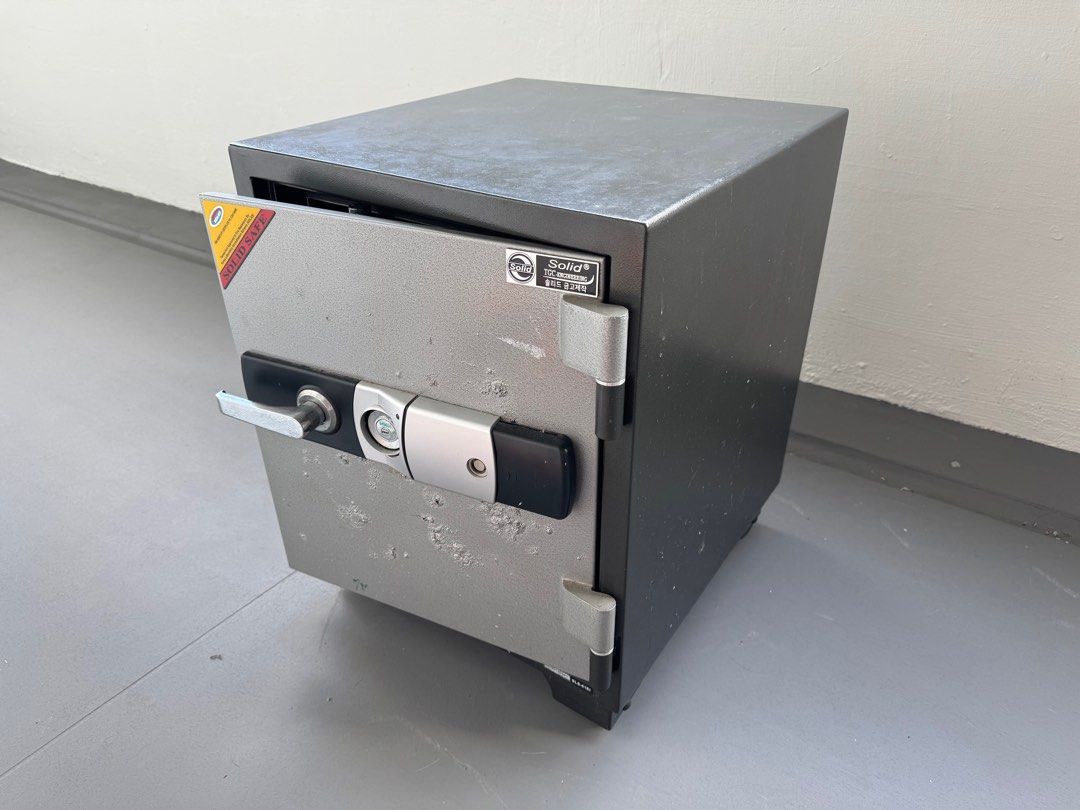 Solid Safe Box (Category: Other Home Appliances) located in Singapore. Submitted by tradeforcoffee (Listing ID 1358405228, Image 3). Description: Model SLS-61E Weight: 110KG Capacity:53L 120 Minute Fire Resistant External Dimensions: H610 X W480 X D550 mm Internal Dimensions: H412 X W340 X D340 mm South Korea Brand Safe bought from GRUPP. Retail Price at $900+ Did not use and kept for some time already. Digital Safe (battery operated pin number p
