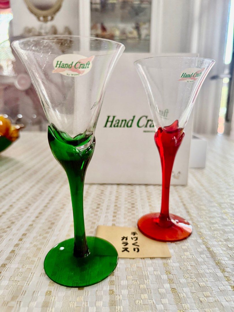 Wine glasses (Category: Other Kitchenware & Tableware) located in Mandaluyong City. Submitted by daisys.collection (Listing ID 1358433959, Image 3). Description: Pair of wine glasses with green and red stems. Made by Wing Japan Height = 7 in/ 12.5 cm Diameter = 3 in/ 7.5 cm Sold in pairs in a box Only 2 pairs available Can be used for Christmas dinners.