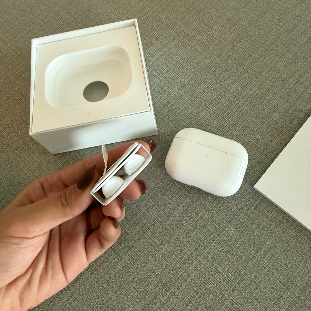 Apple Airpods Pro Gen 1 w/ Complete Accessories (Category: Earphones) located in Quezon City. Submitted by patpotpit (Listing ID 1358689530, Image 3). Description: Original box Brand new ear attachments Lightning charging.