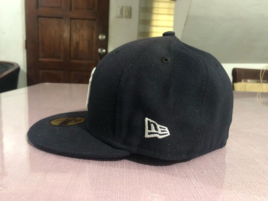 Authentic New Era Cap (Category: Caps & Hats) located in Manila. Submitted by fcbern (Listing ID 1358622584, Image 2). Description: Fresh from New Jersey from Sister Balikbayan. On field Fitted Cap Size 7 55.8 cm. No box. Unused. Check to Sawa.Dark Blue. This is engineered ON Field Caps for MLB players.
