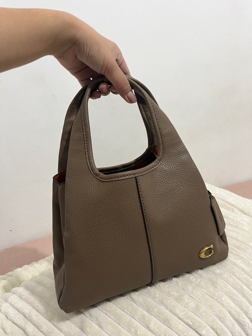 Coach lana shoulder bag w/ sling (Category: Shoulder Bags) located in Caloocan City. Submitted by enic99 (Listing ID 1358659961, Image 2). Description: Lighy used NGA.