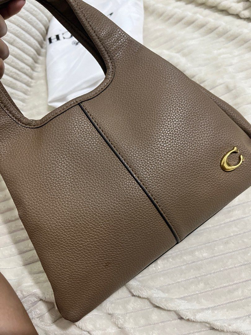 Coach lana shoulder bag w/ sling (Category: Shoulder Bags) located in Caloocan City. Submitted by enic99 (Listing ID 1358659961, Image 3). Description: Lighy used NGA.