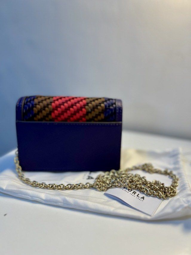 Furla Mini 1927 Crossbody Bag (Category: Luxury Bags & Wallets) located in Quezon City. Submitted by katsstuck (Listing ID 1358694886, Image 3). Description: Furla Mini 1927 Crossbody Bag ✔ Authentic Furla – Comes with a dust bag ✔ High-Quality Craftsmanship – Made from 100% Calf Leather with gold-tone hardware ✔ Trendy & Functional – Compact yet spacious, ideal for essentials ✔ Convertible Chain Strap – Wear it as a crossbody or shoulder bag 📌 