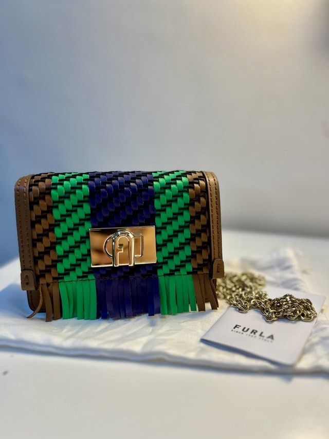 Furla Mini 1927 Crossbody Bag (Category: Luxury Bags & Wallets) located in Quezon City. Submitted by katsstuck (Listing ID 1358694886, Image 2). Description: Furla Mini 1927 Crossbody Bag ✔ Authentic Furla – Comes with a dust bag ✔ High-Quality Craftsmanship – Made from 100% Calf Leather with gold-tone hardware ✔ Trendy & Functional – Compact yet spacious, ideal for essentials ✔ Convertible Chain Strap – Wear it as a crossbody or shoulder bag 📌 