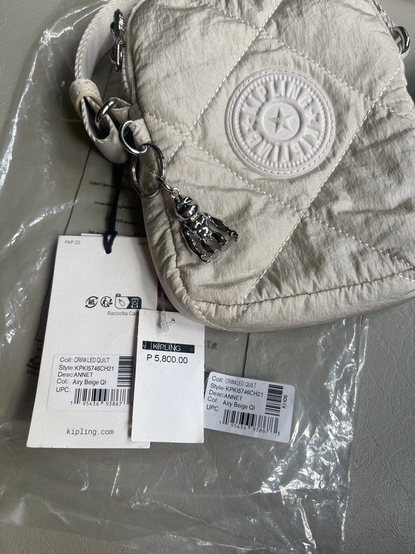 Kipling Crinkled Quilt phone bag (Category: Shoulder Bags) located in Cavite. Submitted by ceejayde (Listing ID 1358542746, Image 3). Description: BRAND NEW WITH TAG. NEVER BEEN USED. Last price posted. No haggling RFS: Impulse buy Php 5,800 on tag .