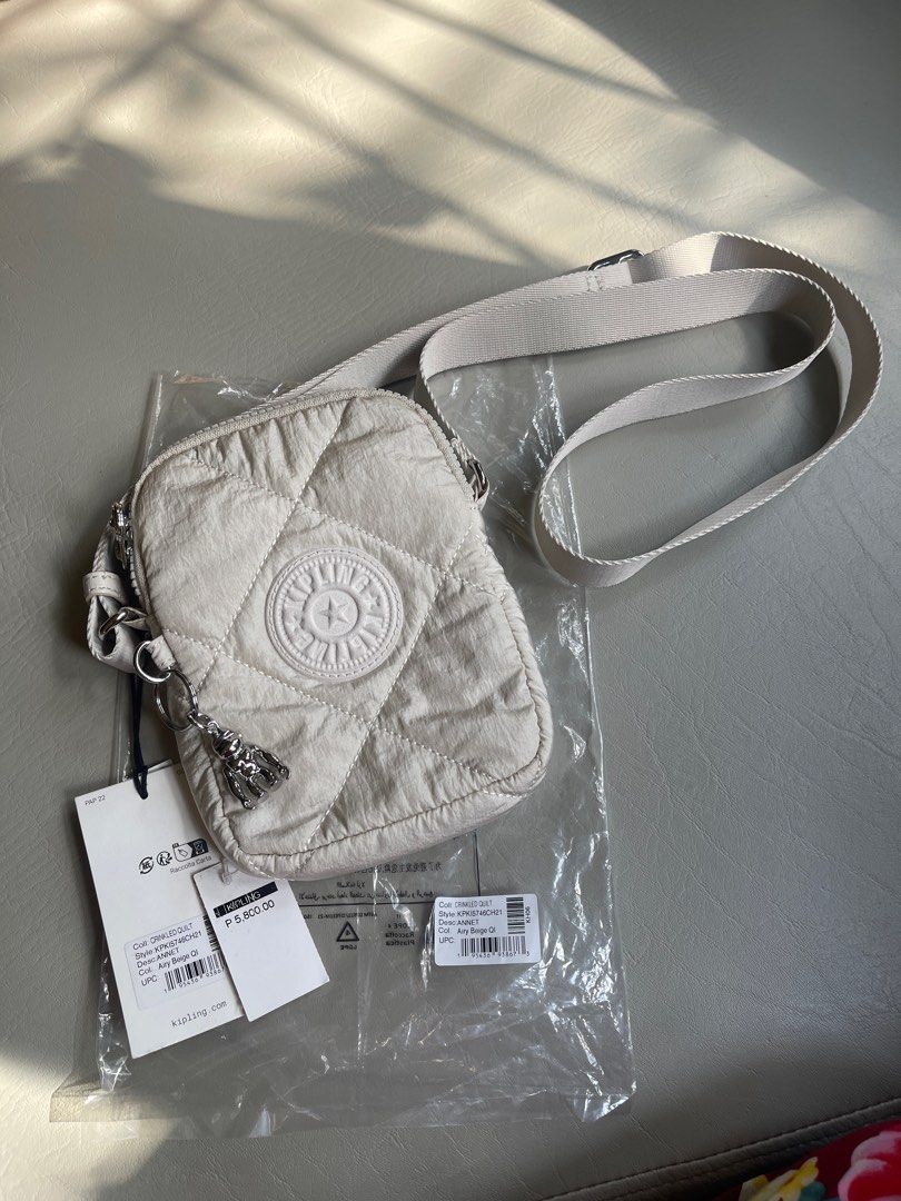 Kipling Crinkled Quilt phone bag (Category: Shoulder Bags) located in Cavite. Submitted by ceejayde (Listing ID 1358542746, Image 1). Description: BRAND NEW WITH TAG. NEVER BEEN USED. Last price posted. No haggling RFS: Impulse buy Php 5,800 on tag .