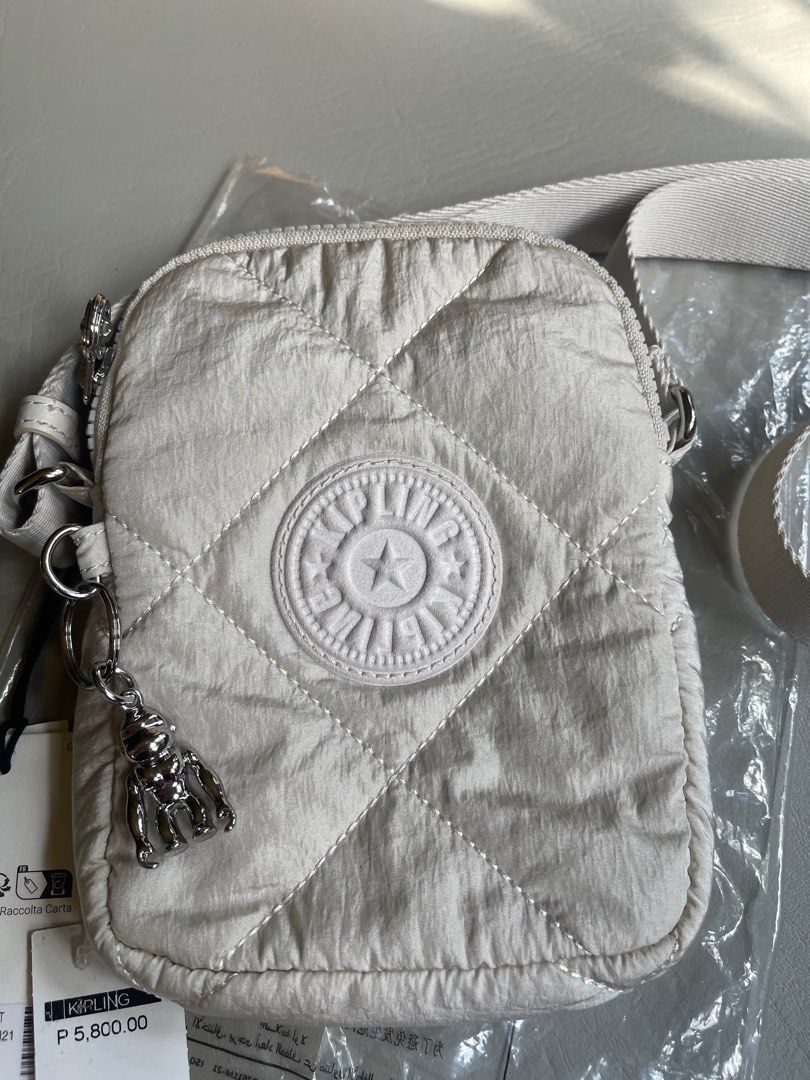 Kipling Crinkled Quilt phone bag (Category: Shoulder Bags) located in Cavite. Submitted by ceejayde (Listing ID 1358542746, Image 2). Description: BRAND NEW WITH TAG. NEVER BEEN USED. Last price posted. No haggling RFS: Impulse buy Php 5,800 on tag .