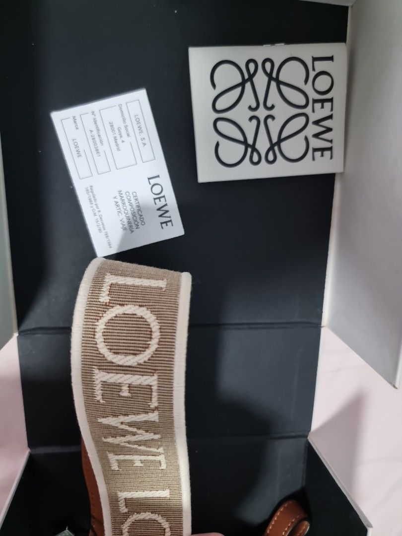 Loewe Anagram Strap (Category: Bags & Wallets) located in Singapore. Submitted by ketoot (Listing ID 1358539708, Image 3). Description: Retails in SG stores at $1150 Anagram loop strap Colour: natural In jacquard and calf skin Comes with dust bag..