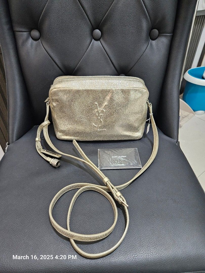 YSL light gold camera bag original (Category: Luxury Bags & Wallets) located in San Juan City. Submitted by rmdeclutter (Listing ID 1358626525, Image 2). Description: decluttering original with card missing tassel thus selling cheap.
