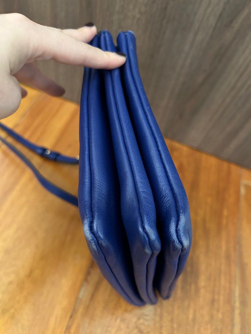 Authentic Celine Trio Bag Large (Category: Luxury Bags & Wallets) located in Paranaque City. Submitted by luxury_finds (Listing ID 1358843526, Image 2). Description: This is Large size and color royal blue, slight scratches on the edge of the bag and the strap has a small tear. Comes with dustbag .