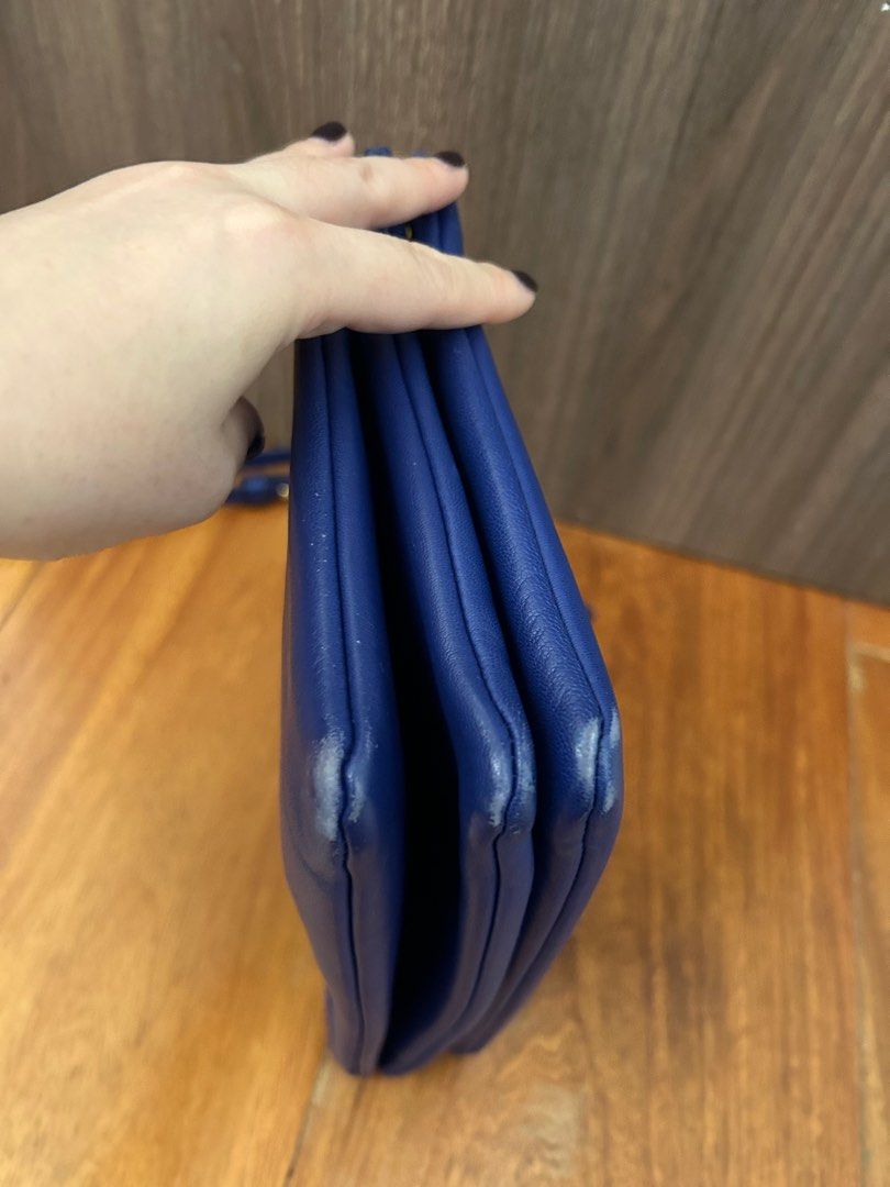 Authentic Celine Trio Bag Large (Category: Luxury Bags & Wallets) located in Paranaque City. Submitted by luxury_finds (Listing ID 1358843526, Image 3). Description: This is Large size and color royal blue, slight scratches on the edge of the bag and the strap has a small tear. Comes with dustbag .