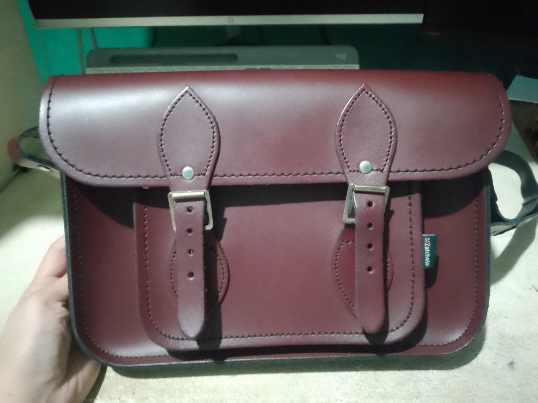 Genuine leather messenger bag (Category: Shoulder Bags) located in Makati City. Submitted by decluttering143 (Listing ID 1358869551, Image 1). Description: ZATCHEL MESSENGER BAG Maroon height 8 inch length 11.5 inches width 2.5 inches.