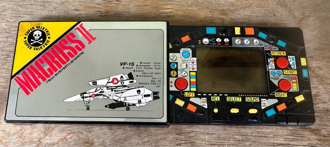 Macross II New System LSI Game and Watch (Category: Others) located in Mandaluyong City. Submitted by collectorsobsessions (Listing ID 1358856444, Image 3). Description: - Not in Mint/Pristine condition. Please see pics. - Games are still working. - Has black spot in the middle with droplets. - Comes as is, what you see is what you get. - PRICE: P2,000.