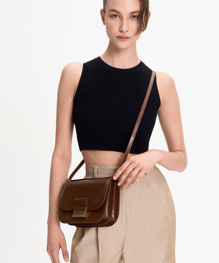 Charles & Keith cross body bag dark brown (Category: Shoulder Bags) located in Quezon City. Submitted by kysse (Listing ID 1359085776, Image 2). Description: Php 3,599 SRP Used once during a trip.