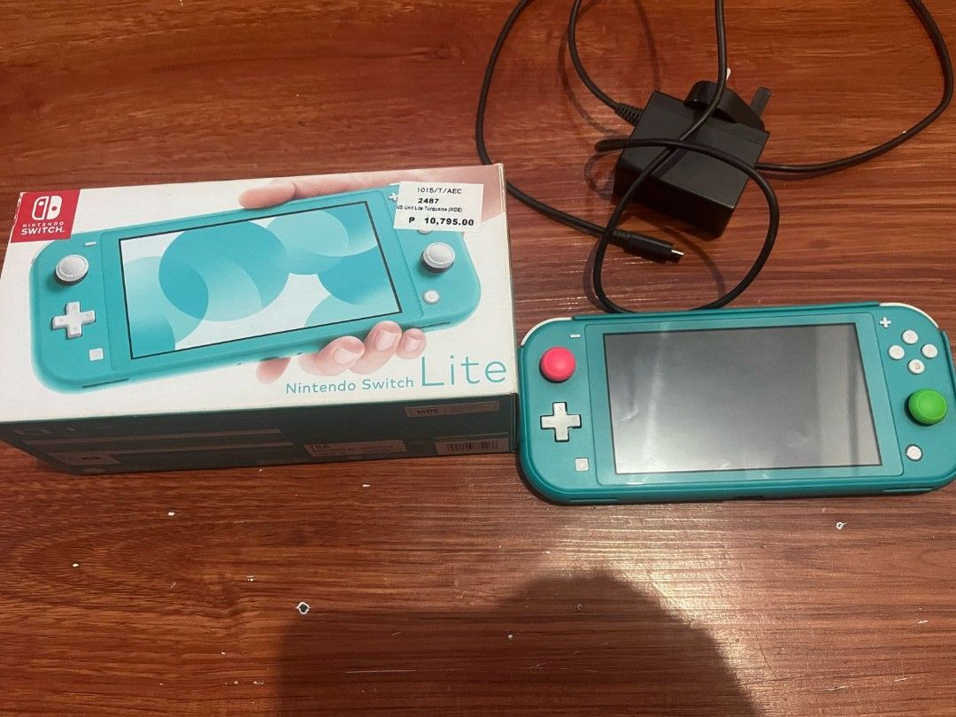 Nintendo Switch Lite (Category: Nintendo) located in Paranaque City. Submitted by GarageSalePhl (Listing ID 1359048745, Image 2). Description: Nintendo Switch Lite (Turquoise Blue) Like new Complete with Box Charger Hard Case Tempered glass since day 1 With game, NBA 2k18 Only 5.5k.