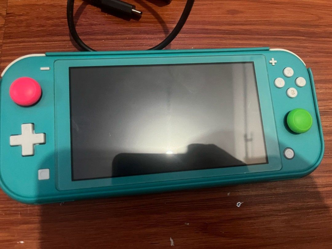 Nintendo Switch Lite (Category: Nintendo) located in Paranaque City. Submitted by GarageSalePhl (Listing ID 1359048745, Image 3). Description: Nintendo Switch Lite (Turquoise Blue) Like new Complete with Box Charger Hard Case Tempered glass since day 1 With game, NBA 2k18 Only 5.5k.