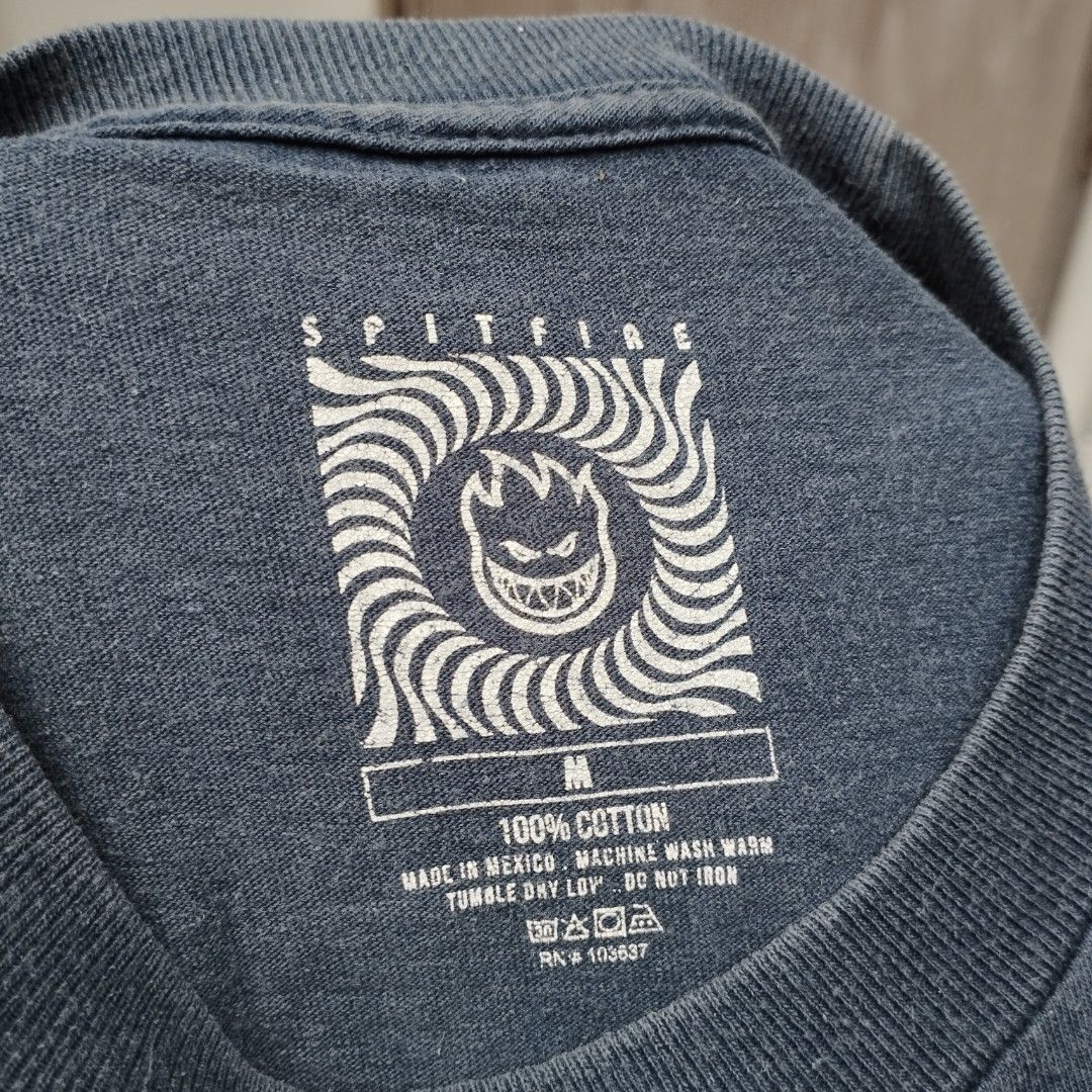 SPITFIRE (Category: Tshirts & Polo Shirts ) located in Mandaluyong City. Submitted by skinny_thrift (Listing ID 1358954788, Image 3). Description: 💸 Php: 350 NEGOTIABLE!!! 📌 Details SPITFIRE Dimes/Size: 19x28 Condition: 8/10 Color rate: 8/10 Issue: Crack prints, small pinhole (back) Pm for more details 📩.