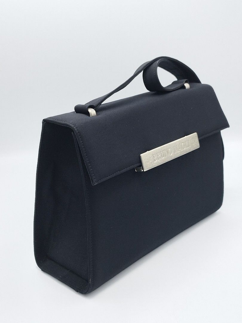 Bruno Magli Vintage Shoulder bag (Category: Luxury Bags & Wallets) located in Quezon City. Submitted by redragtag (Listing ID 1359142566, Image 3). Description: Authentic, vintage Bruno Magli shoulder bag Made in Italy Measurements: Height 7.75" x Length 11" x Depth 3" This bag features a flap with metal bar swing closure displaying the brand name " Bruno Magli". Characterized by black nylon-fabric exterior and a silver-toned hardware. Lined with