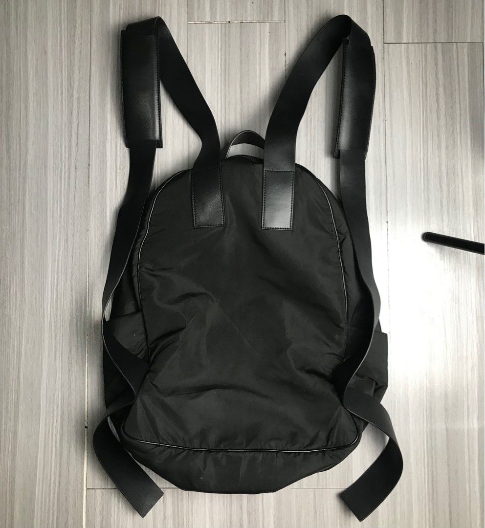 Fear of God Trimmed Shell Backpack Appliquéd Leather Logo (Category: Backpacks) located in Cabanatuan. Submitted by cabsygoods (Listing ID 1359283402, Image 3). Description: Fear of God Trimmed Shell Backpack Appliquéd Leather Logo Width 12.5 Height 17 Very good condition Issue removable stain Color rate 9/10 Dm to purchase! 📩.