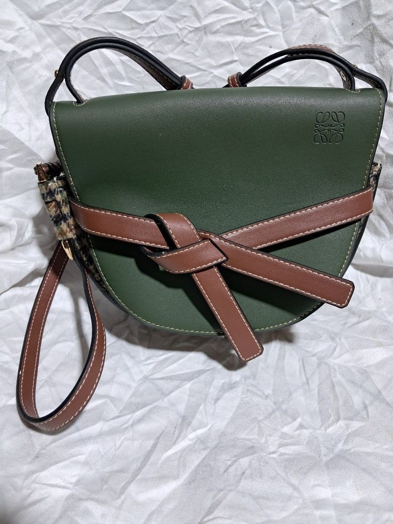 LOEWE Gate Bag Tweed Green Brown (Category: Luxury Bags & Wallets) located in Butuan. Submitted by fabchichub (Listing ID 1359272479, Image 1). Description: This chic crossbody is crafted of multicolored woven tweed. Opens up to a brown partition and patch pocket with a stylish strap as a closure. Size/Dimensions (Approx.) Height 18cm-7" Max. width 28cm-11" Max. depth 13cm-5" Min. length shoulder strap 65cm-25.5" Max. length shoulder strap 100cm-