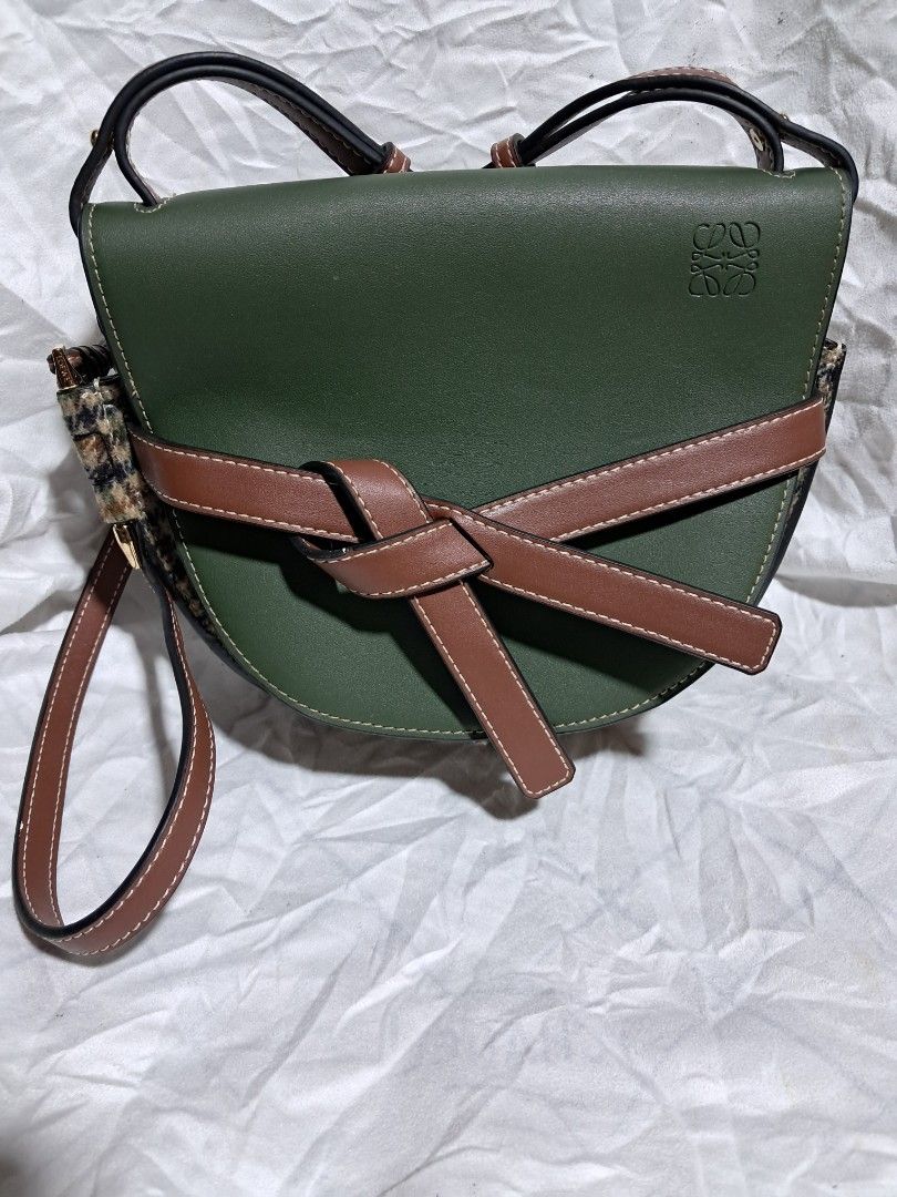LOEWE Gate Bag Tweed Green Brown (Category: Luxury Bags & Wallets) located in Butuan. Submitted by fabchichub (Listing ID 1359272479, Image 2). Description: This chic crossbody is crafted of multicolored woven tweed. Opens up to a brown partition and patch pocket with a stylish strap as a closure. Size/Dimensions (Approx.) Height 18cm-7" Max. width 28cm-11" Max. depth 13cm-5" Min. length shoulder strap 65cm-25.5" Max. length shoulder strap 100cm-