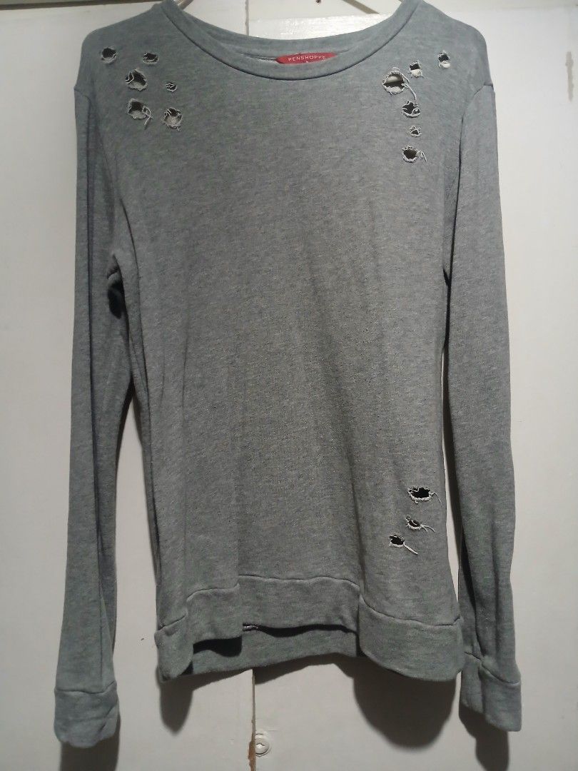 Pre Loved- Penshoppe- Gray Hole Design Sweatshirt- Medium Size (Category: Coats, Jackets and Outerwear) located in Quezon City. Submitted by mimil_ (Listing ID 1359269018, Image 1). Description: Penshoppe Gray sweatshirt with hole deisgn Can fit from small to medium size Used it twice or thrice.