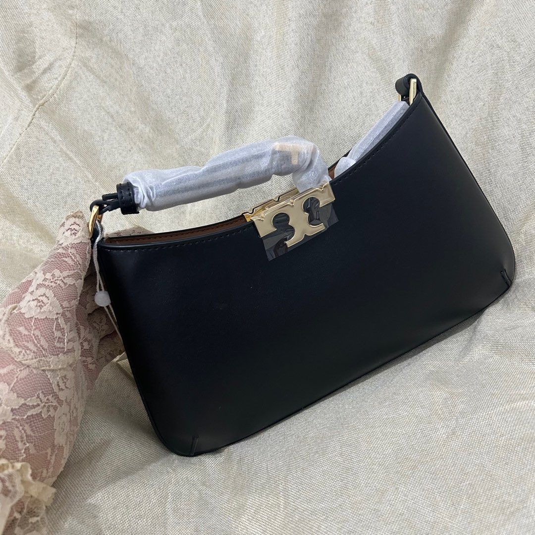 TB - Tory Burch Black Eleanor Slim (Category: Luxury Bags & Wallets) located in Quezon City. Submitted by luxurybyluci (Listing ID 1359260127, Image 3). Description: Tory Burch Black Eleanor Slim Leather Material Complete with Inclusions Authentic On Hand.