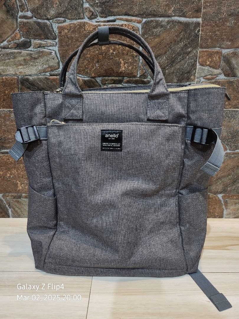 Anello Backpack 2-way Tote Backpack (Category: Luxury Bags & Wallets) located in Marikina City. Submitted by keen.sabkeith (Listing ID 1355975885, Image 1). Description: The popular heathered polyester canvas series comes with a 2-way backpack that can also be used as tote bag Color: Gray 10 pockets (inner pockets - 4; outer pockets - 6) H: 37 cm W: 27 cm D: 15 cm Originally bought from Anello Japan. NO receipts po as this was a pasabuy from my f