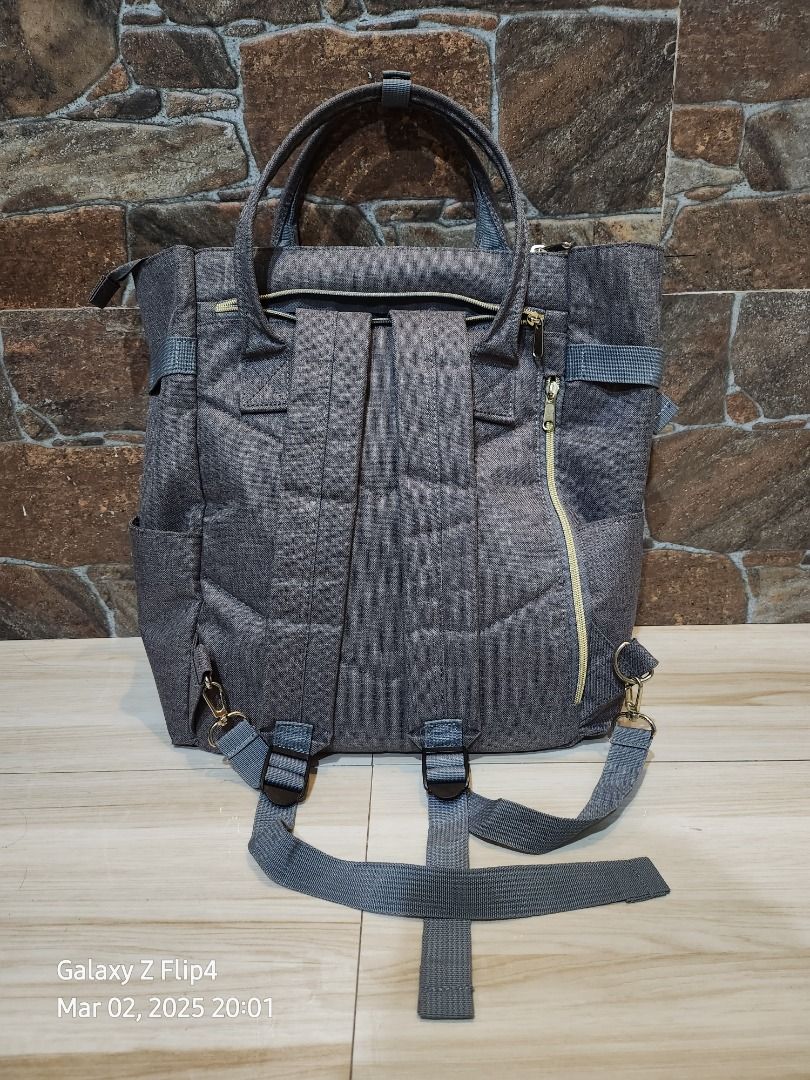Anello Backpack 2-way Tote Backpack (Category: Luxury Bags & Wallets) located in Marikina City. Submitted by keen.sabkeith (Listing ID 1355975885, Image 2). Description: The popular heathered polyester canvas series comes with a 2-way backpack that can also be used as tote bag Color: Gray 10 pockets (inner pockets - 4; outer pockets - 6) H: 37 cm W: 27 cm D: 15 cm Originally bought from Anello Japan. NO receipts po as this was a pasabuy from my f