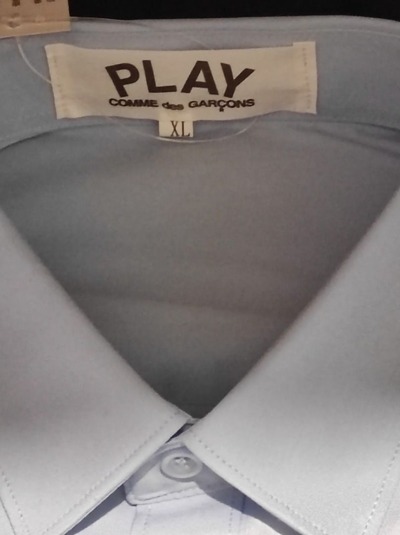 CDG light blue formal button down shirt (Category: Formal Shirts) located in Quezon City. Submitted by babybomber69 (Listing ID 1355973554, Image 2). Description: Brand New Size XL Dimensions: Approx. Width: 57cm Length: 72cm.