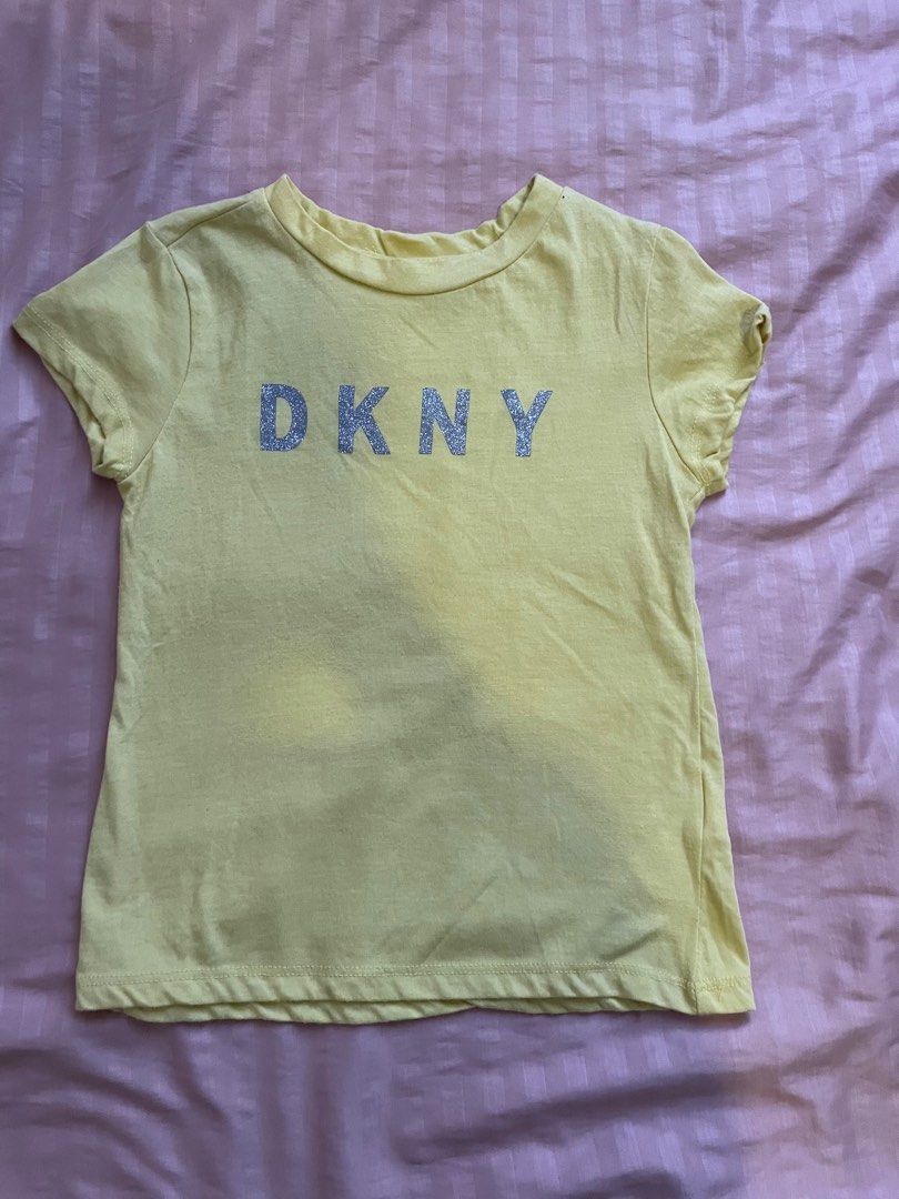 DKNY Shirt in yellow (5T) (Category: Babies & Kids Fashion) located in Paranaque City. Submitted by lexivd (Listing ID 1355885500, Image 1). Description: Check my other listings for more clothes like these. SF to be shouldered by buyer. Loc: Paranaque or Makati.