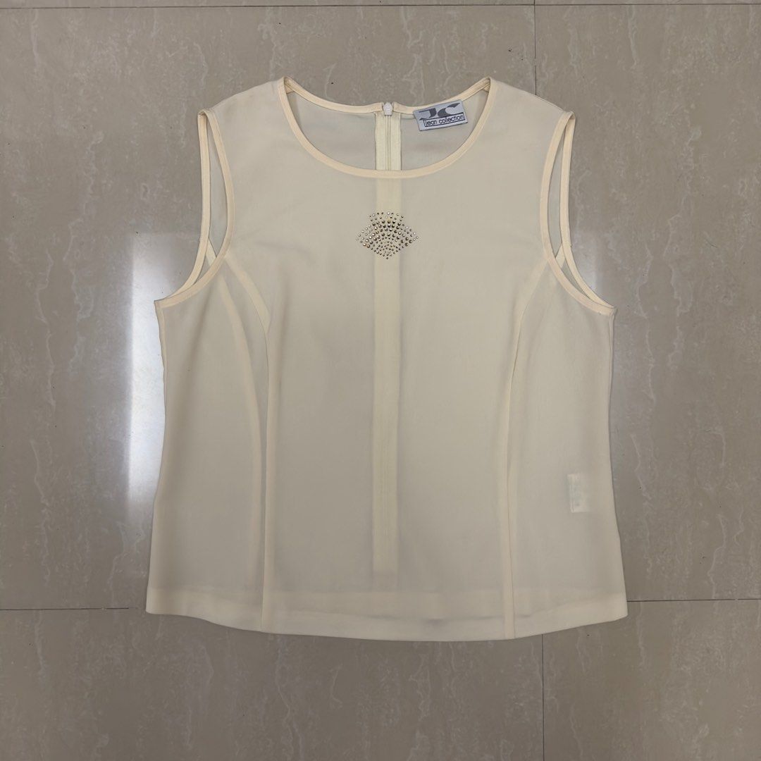Jean Collection Vintage Sleeveless (Category: Sleeveless) located in Rizal. Submitted by ffoie (Listing ID 1355899728, Image 1). Description: Pale Yellow color Pit to pit measure: 17.5 in RFS: declutter .