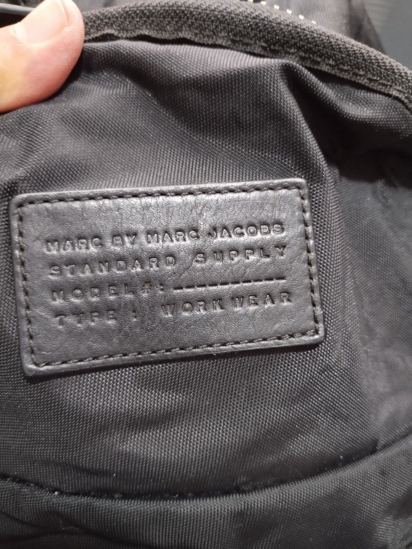 marc jacobs backpack (Category: Luxury Bags & Wallets) located in Baguio. Submitted by roozeydluc (Listing ID 1356014638, Image 2). Description: polyester material large size l:12.5" w:5" h:16.5" 🔎mga small bubbles sa side part ✓1 zippered compartment ✓2 zippered front pocket.