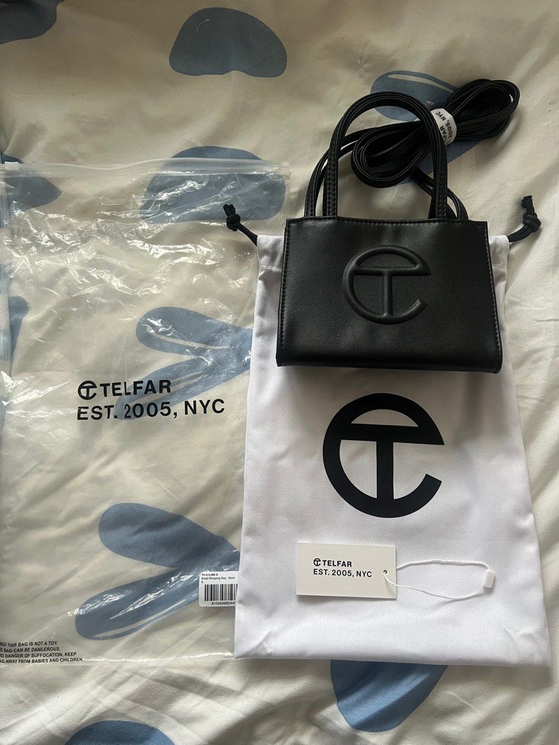 Telfar Small Shopping Bag in Black (Category: Luxury Bags & Wallets) located in Pasig City. Submitted by kurtlorraine (Listing ID 1350663580, Image 1). Description: Telfar Small Shopping Bag in Black - Comes with original plastic, tags, & dust bag - Used in my Japan trip only - 100% Authentic bought in States - No flaws, scratchs - Can pass as brand new .