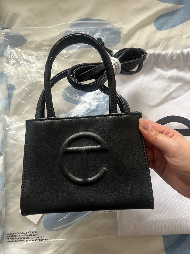 Telfar Small Shopping Bag in Black (Category: Luxury Bags & Wallets) located in Pasig City. Submitted by kurtlorraine (Listing ID 1350663580, Image 3). Description: Telfar Small Shopping Bag in Black - Comes with original plastic, tags, & dust bag - Used in my Japan trip only - 100% Authentic bought in States - No flaws, scratchs - Can pass as brand new .